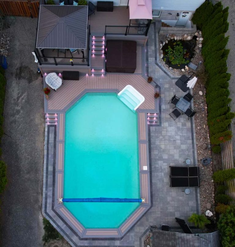 Drone view of a custom built above ground composite pool deck by Aurora Exteriors Inc.