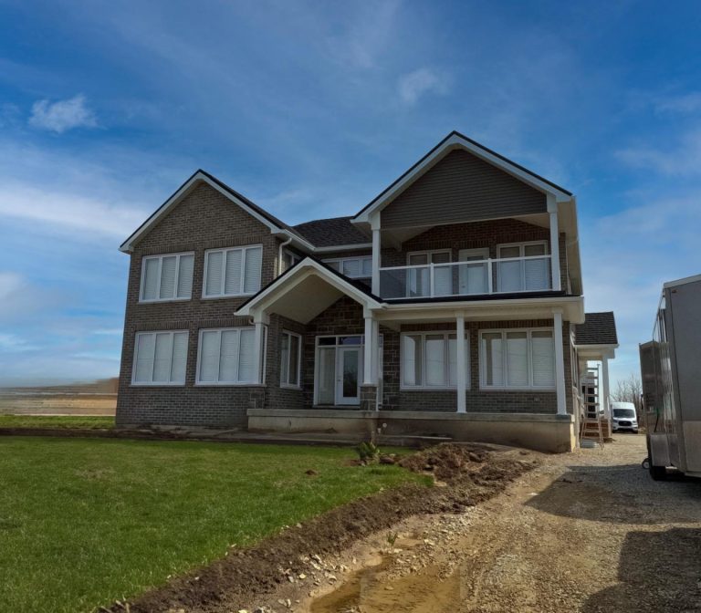 New Construction Home Exterior Finishing Project, featuring castlemore vinyl siding, white aluminum post wraps, railings and trims