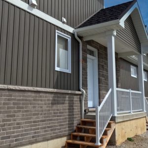 Side Porch with White Aluminum Railings and Matching Post Wraps Installed by Aurora Exteriors Inc.