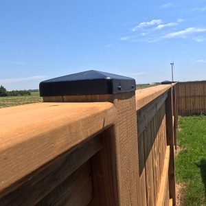 Black Fence Post Cap on a Pressure Treated Wood Privacy Fence